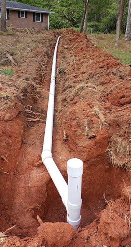 drain-line-service-concord-nc Underground drain line replacement at a Concord, NC home